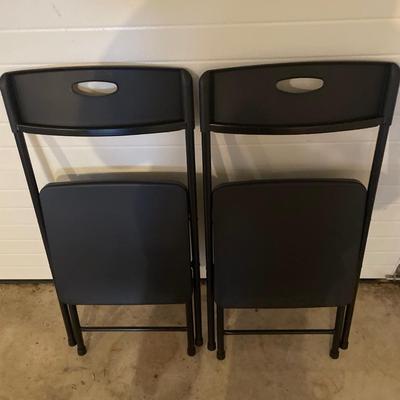2 plastic foldable chairs