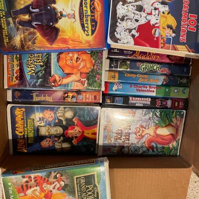 Box full of vintage kids VHS movies