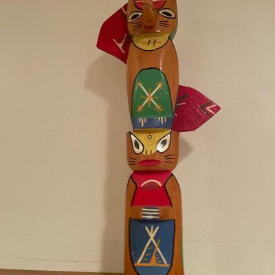 Wood totem pole and pipe