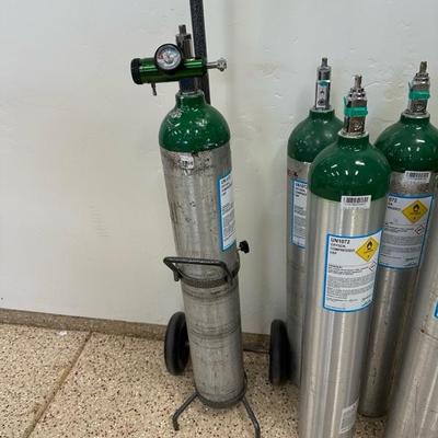 Lot 283 Six ME size portable oxygen tanks plus tank cart