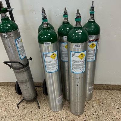 Lot 283 Six ME size portable oxygen tanks plus tank cart