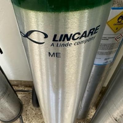 Lot 283 Six ME size portable oxygen tanks plus tank cart