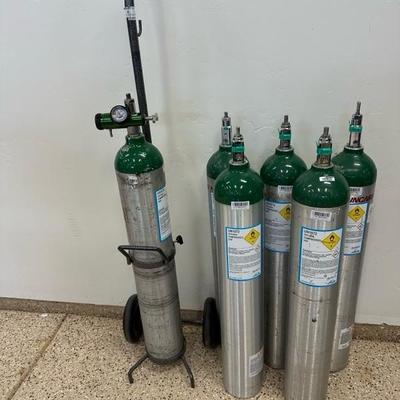 Lot 283 Six ME size portable oxygen tanks plus tank cart