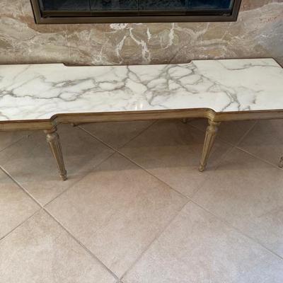 Lot 378 Marble topped, eight legged table