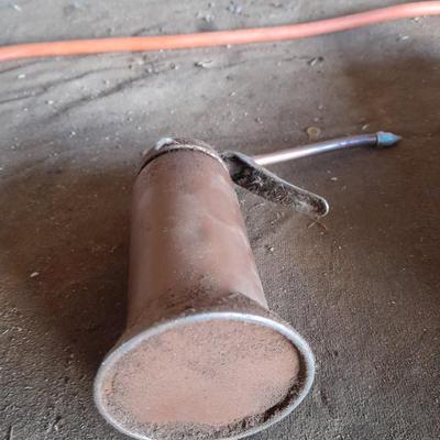Copper colored oil can