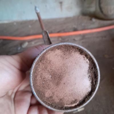 Copper colored oil can
