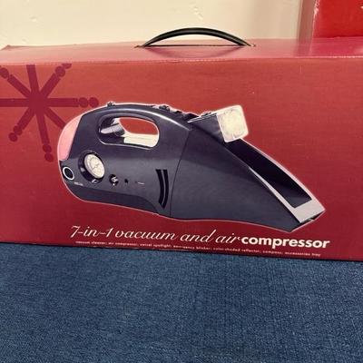 Lot 295 Seven in one vacuum and air compressor and car care kit