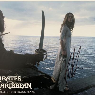 Pirates of the Caribbean: The Curse of the Black Pearl Keira Knightley signed lobby card. GFA Authenticated