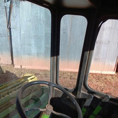 John Deere 830 Windrower swather