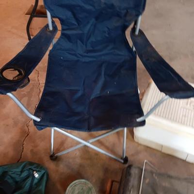 Folding camp chair, Cooler, Grill, and an assortment of other camping items