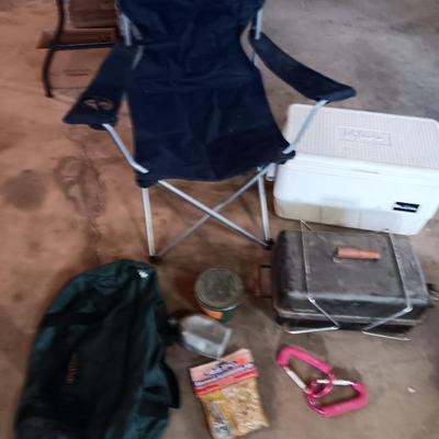 Folding camp chair, Cooler, Grill, and an assortment of other camping items