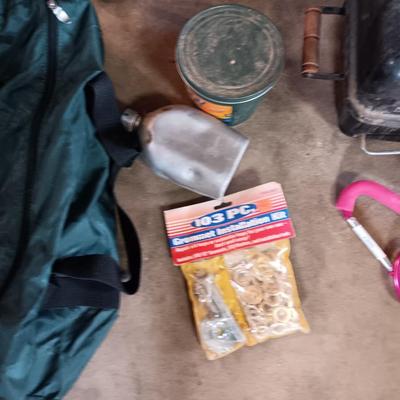 Folding camp chair, Cooler, Grill, and an assortment of other camping items