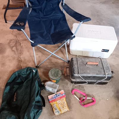 Folding camp chair, Cooler, Grill, and an assortment of other camping items