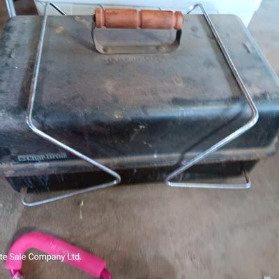 Folding camp chair, Cooler, Grill, and an assortment of other camping items
