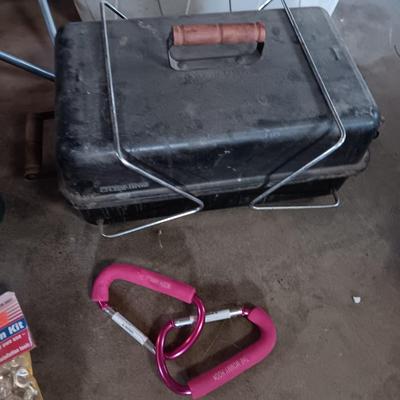 Folding camp chair, Cooler, Grill, and an assortment of other camping items