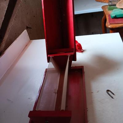 Wooden handmade bird feeder and a Glass globed hummingbird feeder.