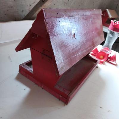 Wooden handmade bird feeder and a Glass globed hummingbird feeder.