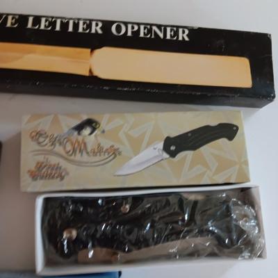 Three new pocketknives and a new executive letter opener
