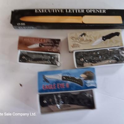 Three new pocketknives and a new executive letter opener