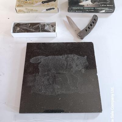 Lasered art tile with wolf and two new pocketknives