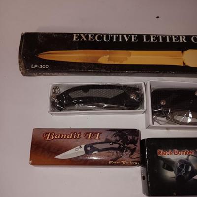 Two new pocketknives and an Executive letter opener