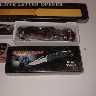 Two new pocketknives and an Executive letter opener