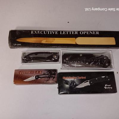 Two new pocketknives and an Executive letter opener