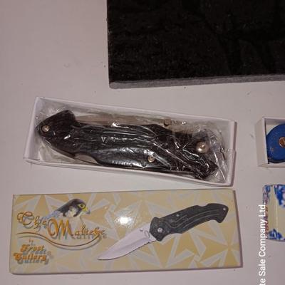 Lasered art tile with Elk and two new pocketknives