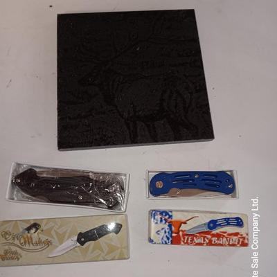 Lasered art tile with Elk and two new pocketknives