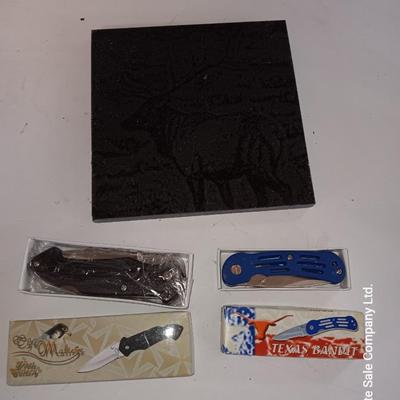 Lasered art tile with Elk and two new pocketknives