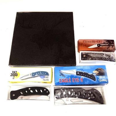 Three new pocketknives and a lasered art tile of a Moose