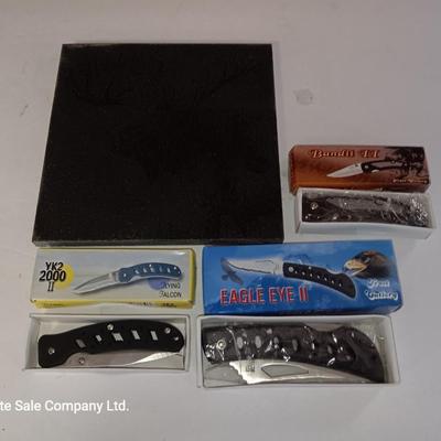 Three new pocketknives and a lasered art tile of a Moose