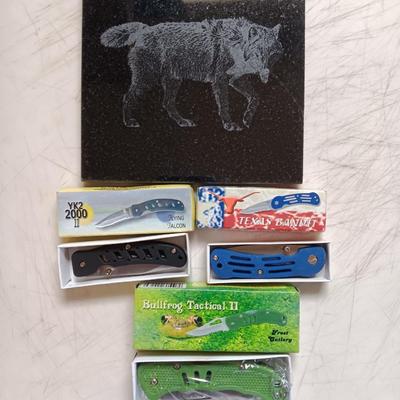 Lasered art tile with a Wolf and three new Pocketknives