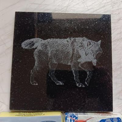 Lasered art tile with a Wolf and three new Pocketknives