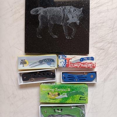 Lasered art tile with a Wolf and three new Pocketknives