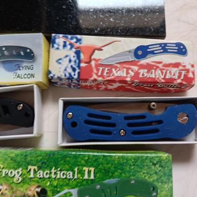 Lasered art tile with a Wolf and three new Pocketknives