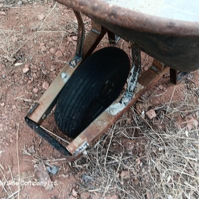 Steel framed wheelbarrow with metal handles