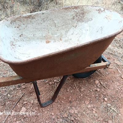Steel framed wheelbarrow with metal handles