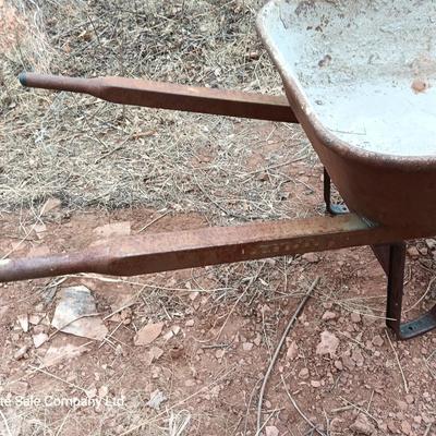 Steel framed wheelbarrow with metal handles