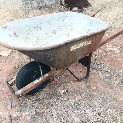 Steel framed wheelbarrow with metal handles