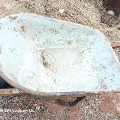 Steel framed wheelbarrow with metal handles