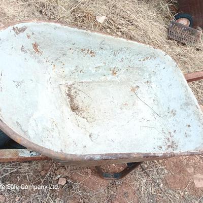 Steel framed wheelbarrow with metal handles