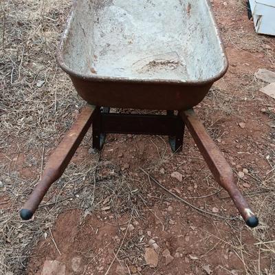 Steel framed wheelbarrow with metal handles