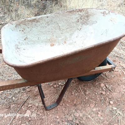 Steel framed wheelbarrow with metal handles