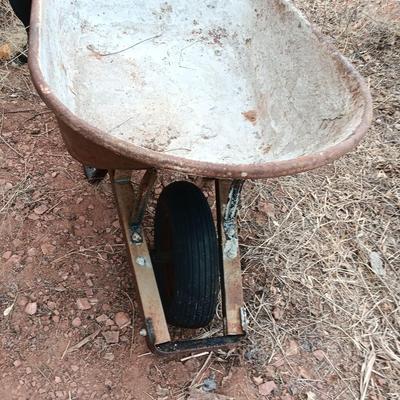 Steel framed wheelbarrow with metal handles