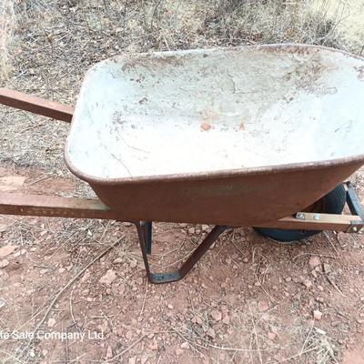 Steel framed wheelbarrow with metal handles