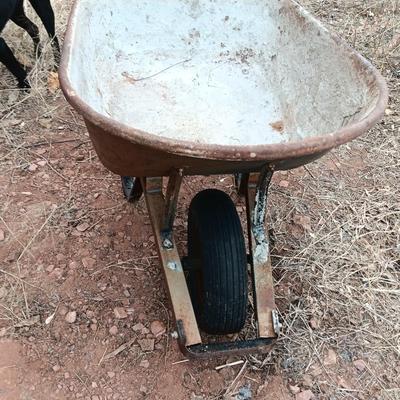 Steel framed wheelbarrow with metal handles