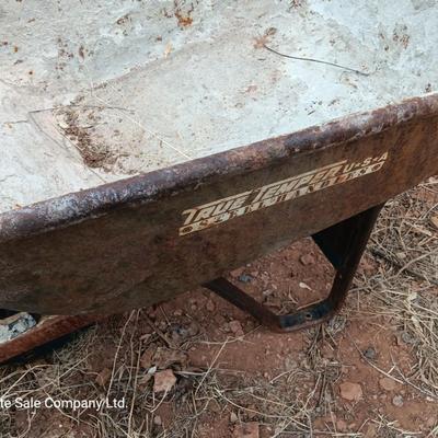Steel framed wheelbarrow with metal handles
