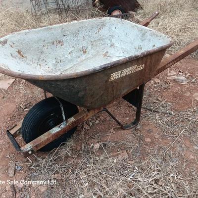 Steel framed wheelbarrow with metal handles