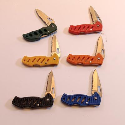 Six pocketknives each a different color